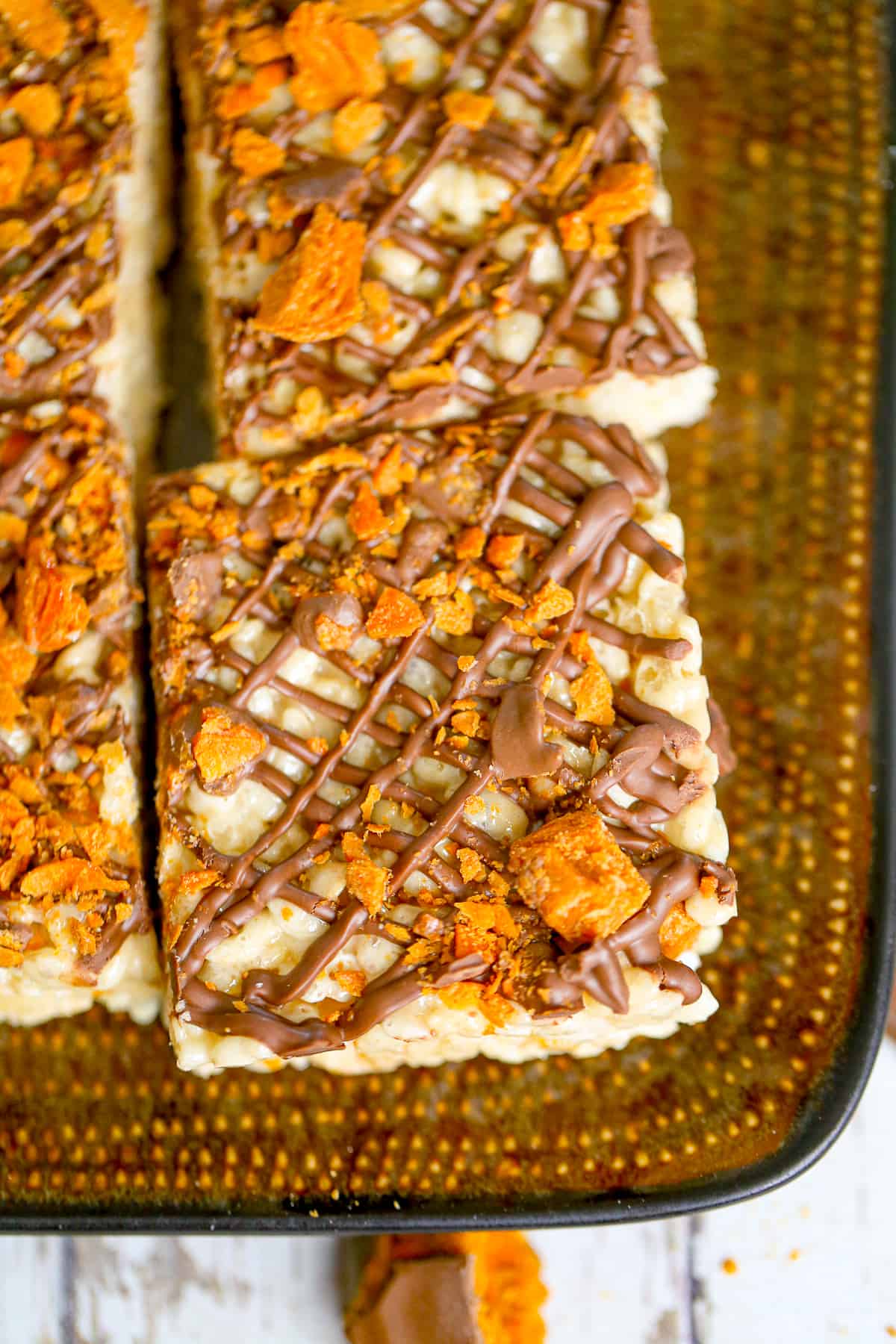 corner pieces of rice krispies with butterfinger candy bar