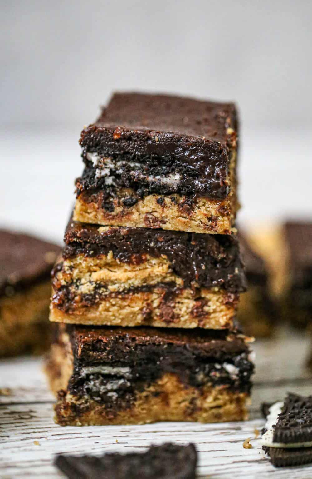 These tempting Slutty Peanut Butter Chocolate Chip Brownies have Nutter Butters & Oreos layered inside peanut butter cookie dough & brownies!