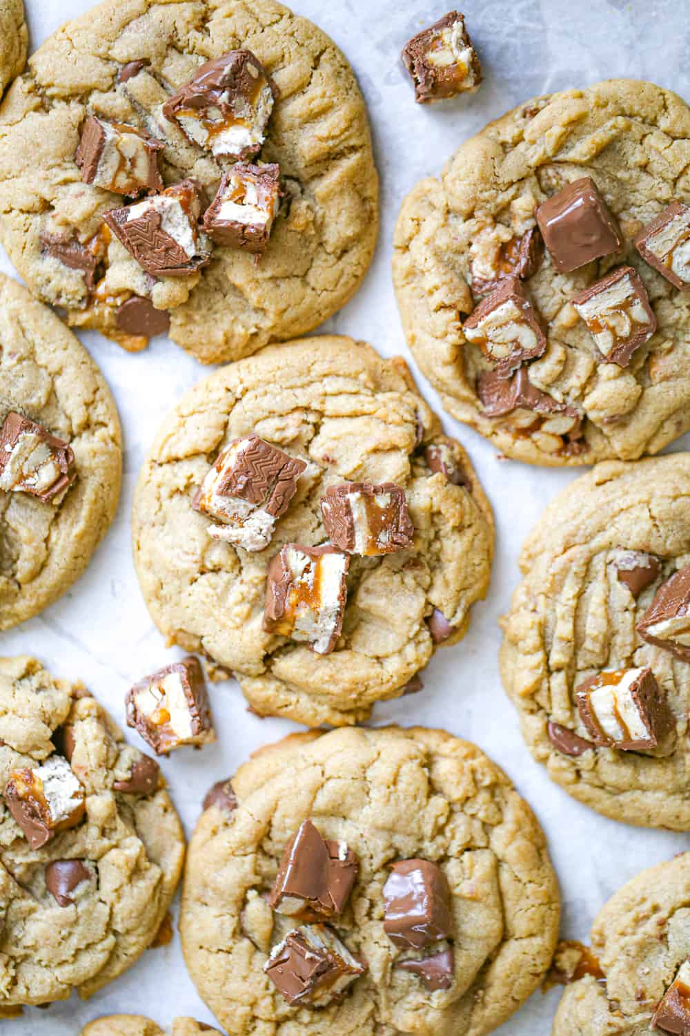 snickers peanut butter cookies with snickers bars on top