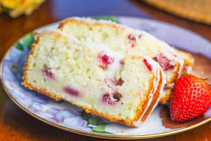 slices of Easy Lemon Strawberry Yogurt Pound Cake with lemon glaze