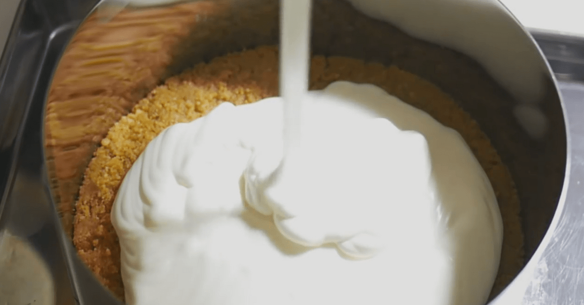 pouring cream cheese mixture into springform pan