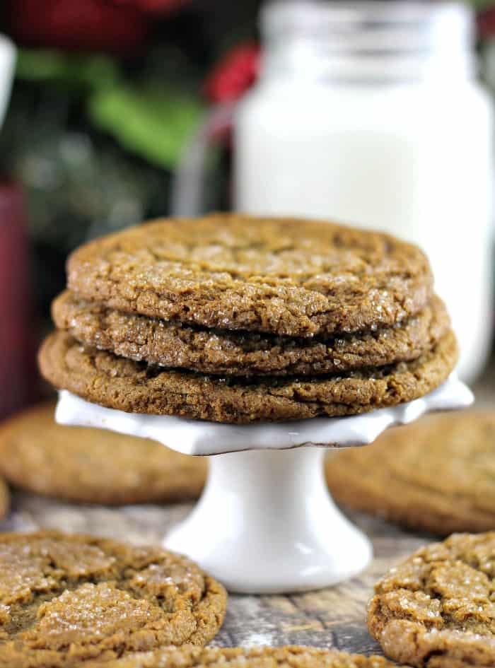 Soft and Chewy Ginger Molasses Cookies recipe stacked on a pedestal