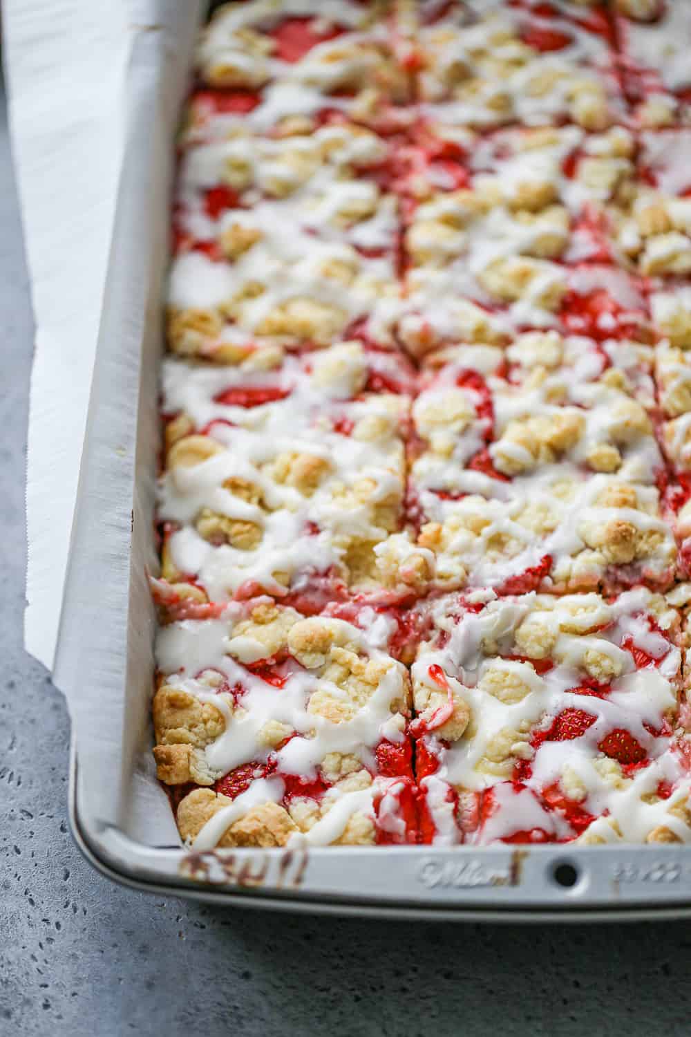 Strawberry Cream Cheese Bars in a pan sliced