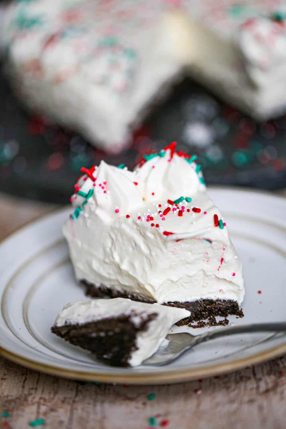 Easy Eggnog Cheesecake with bite out of it