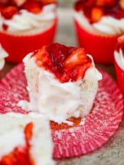 Strawberry Shortcake Cupcakes are vanilla cakes filled with light and fluffy whipped cream and finished with cream cheese frosting and fruity strawberry filling on top. 