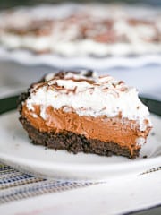This heavenly no-bake Nutella Cream Pie has an awesome Oreo crust with an amazing chocolate Nutella cheesecake filling and fluffy whipped cream on top! You can easily whip up this easy 5 ingredient Nutella pie recipe with an Oreo crust in less than 15 minutes!