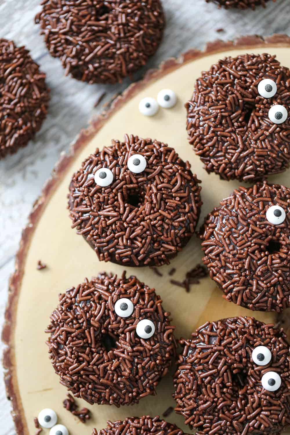 These Fun Chocolate Sprinkle Donuts make the most fun breakfast or party goodies and they’re easy to mix up since they’re baked instead of fried!  These mini chocolate donuts are perfect for Halloween and when chocolate treats are on the radar!