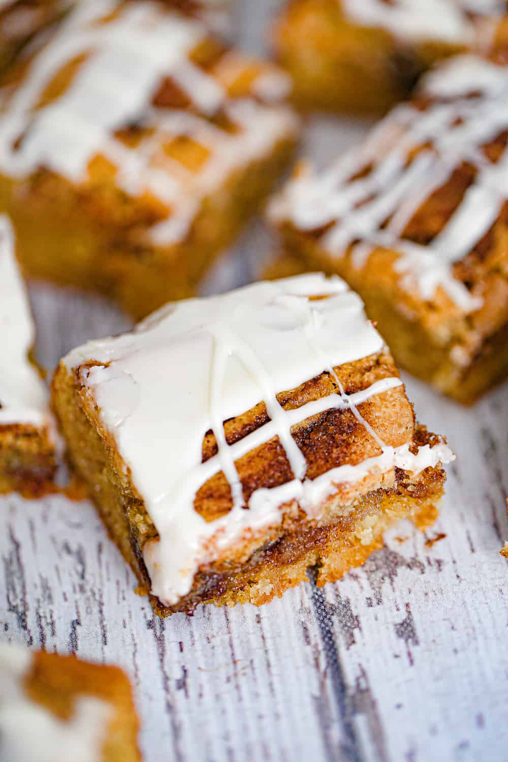 These scrumptious Cinnamon Roll Blondies are blondies with a buttery, cinnamon-sugar mixture swirled in and topped with a simple vanilla cream glaze.