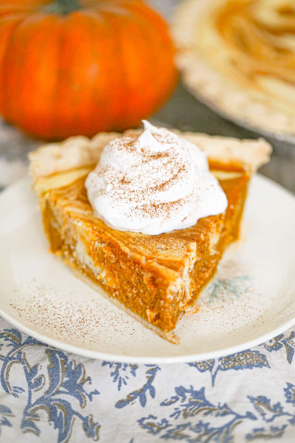 pumpkin cheesecake pie recipe with whipped cream on top!