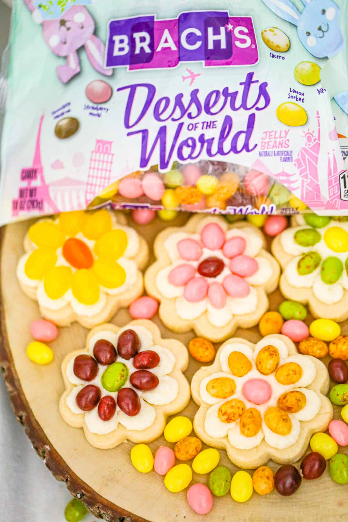 Everyone loves to indulge in these colorful Easter Jelly Bean Flower Cookies topped with a simple buttercream frosting & BRACH's jelly beans! 