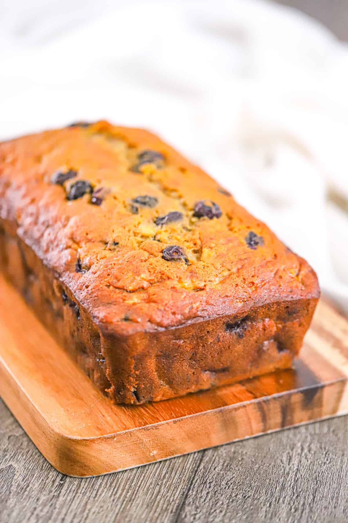 Blueberry banana bread loaf with juicy blueberries and golden top