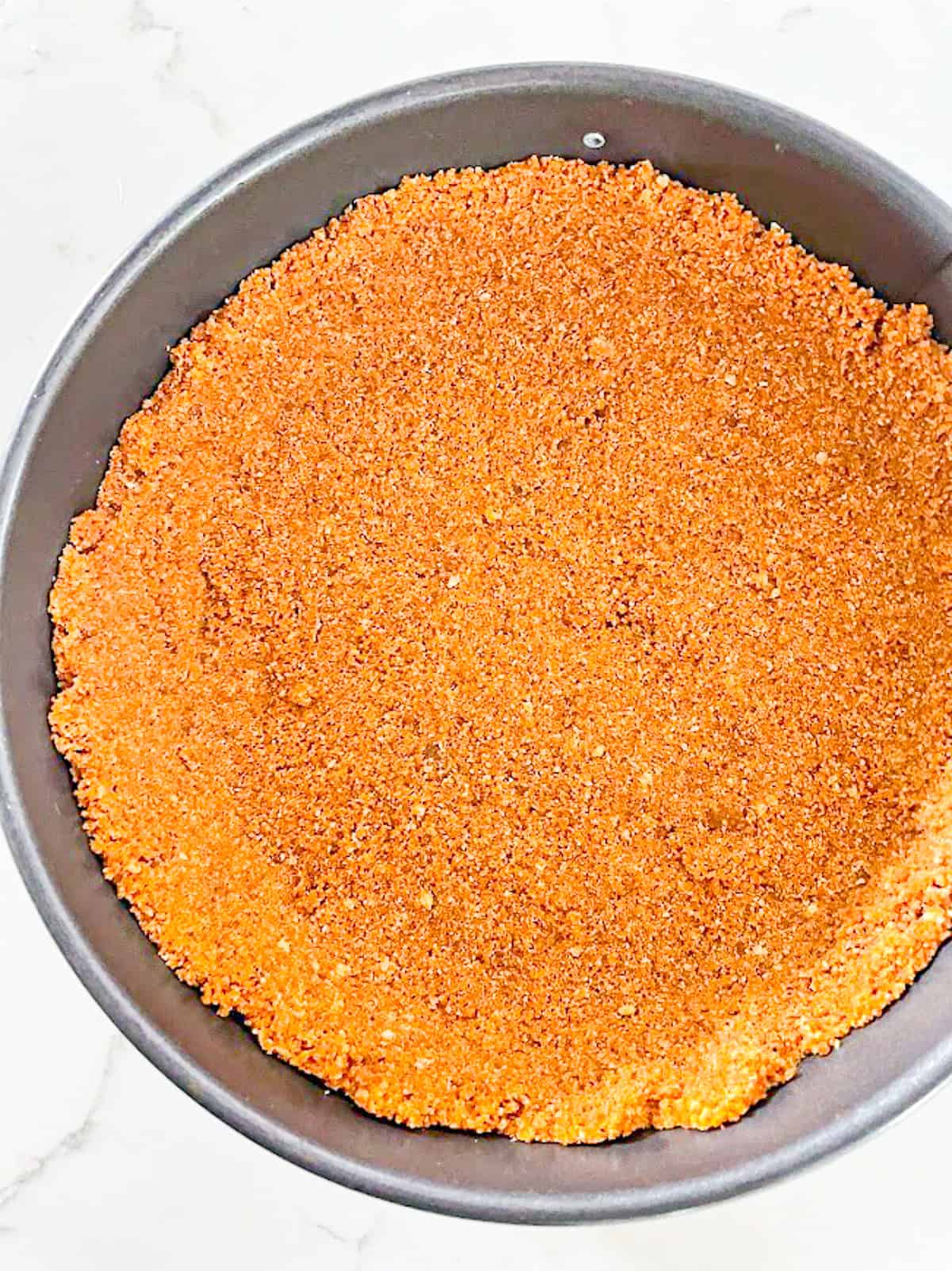 biscoff cookie crust pressed in pan
