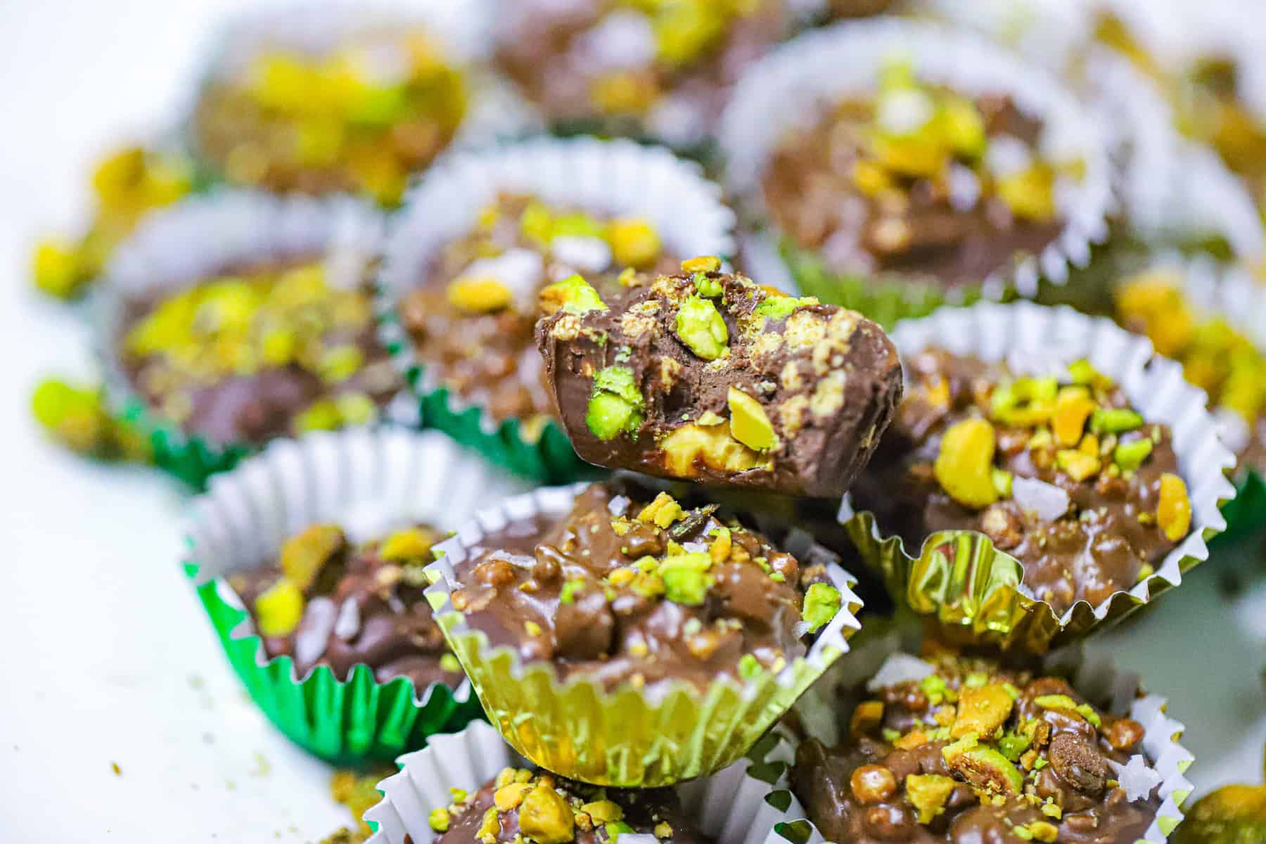 Overhead view of mini candy cups in paper liners on a countertop