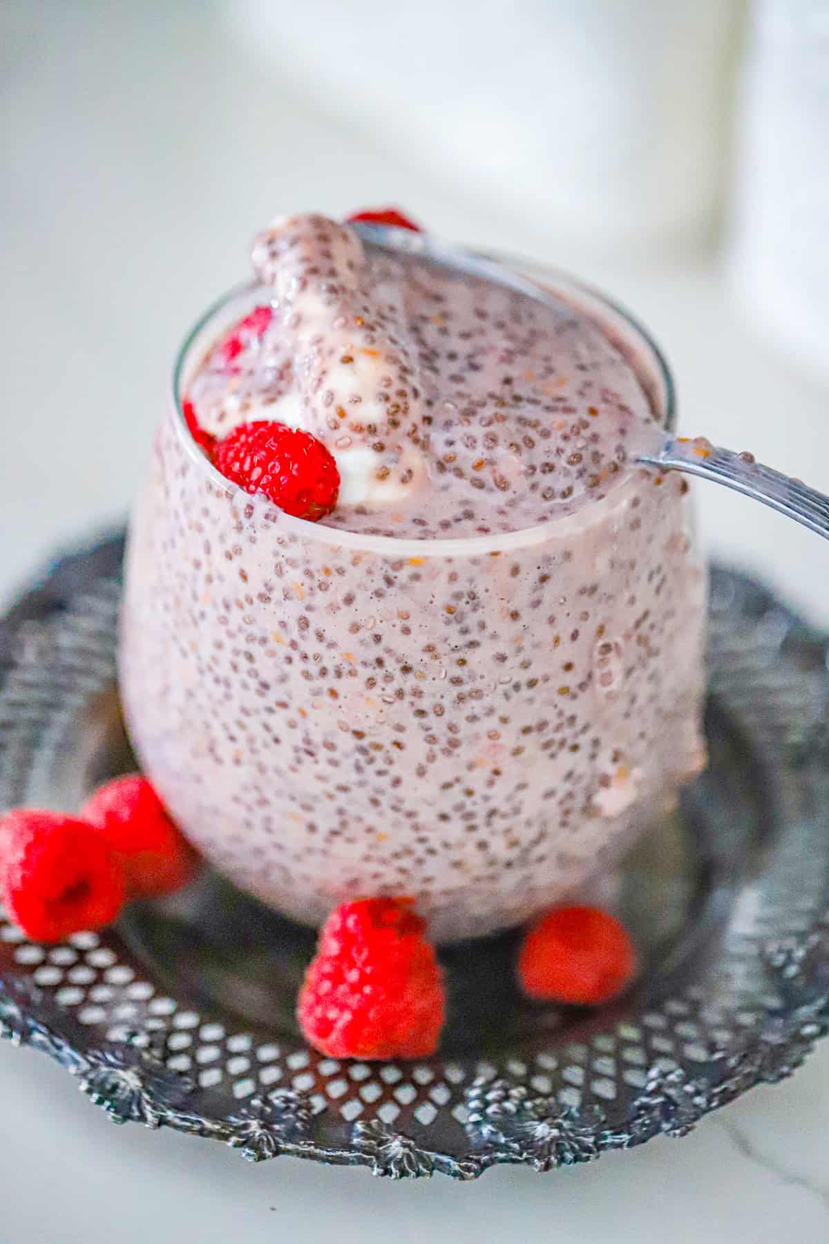 raspberry chia pudding topped with fresh berries
