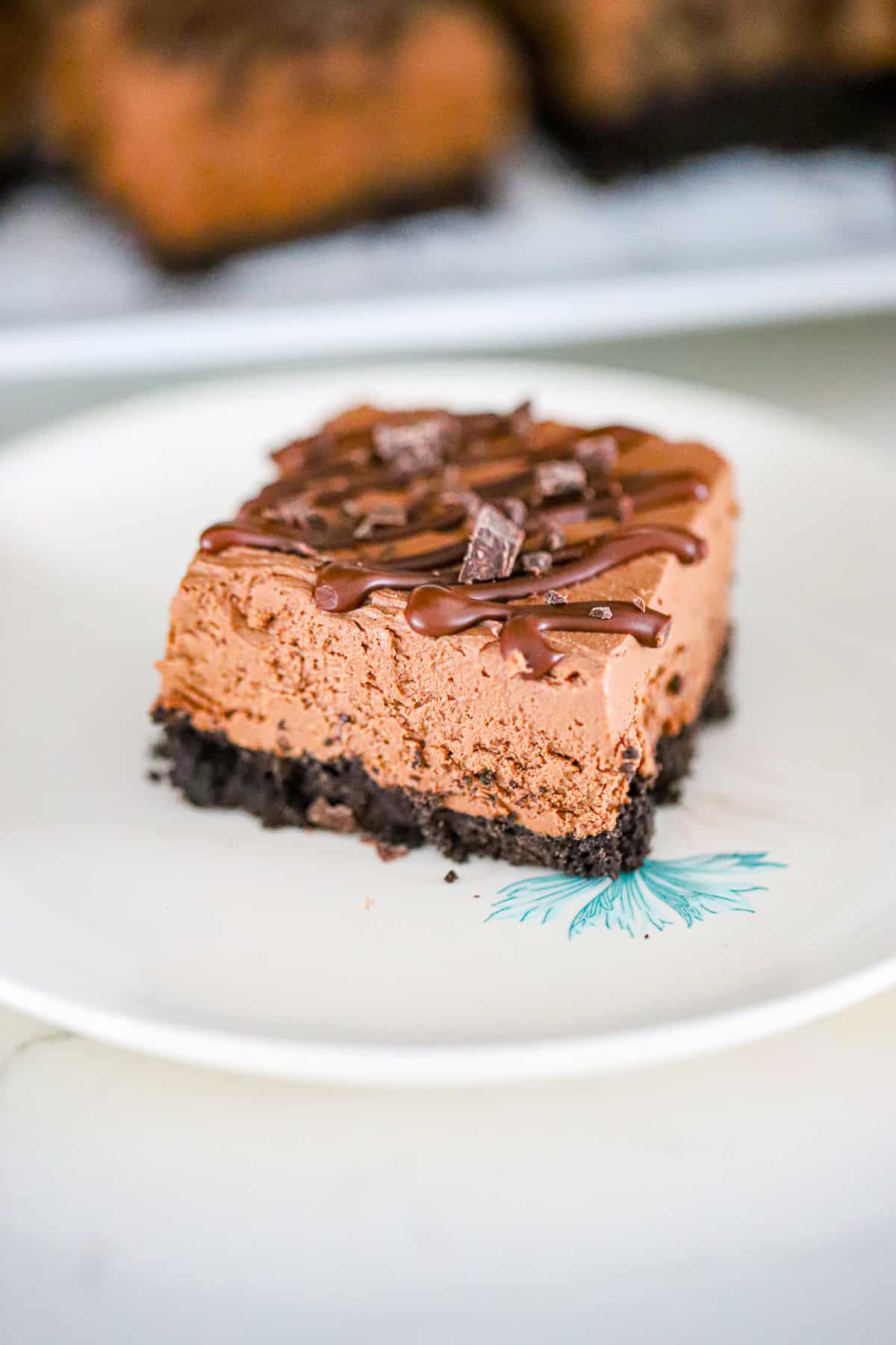 Close-up of rich chocolate fudge protein cheesecake bar