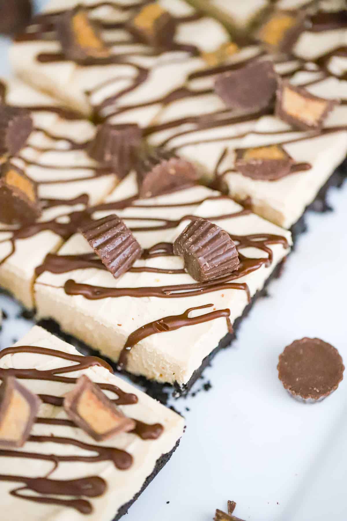 No-bake peanut butter cup cheesecake with chocolate drizzle on top
