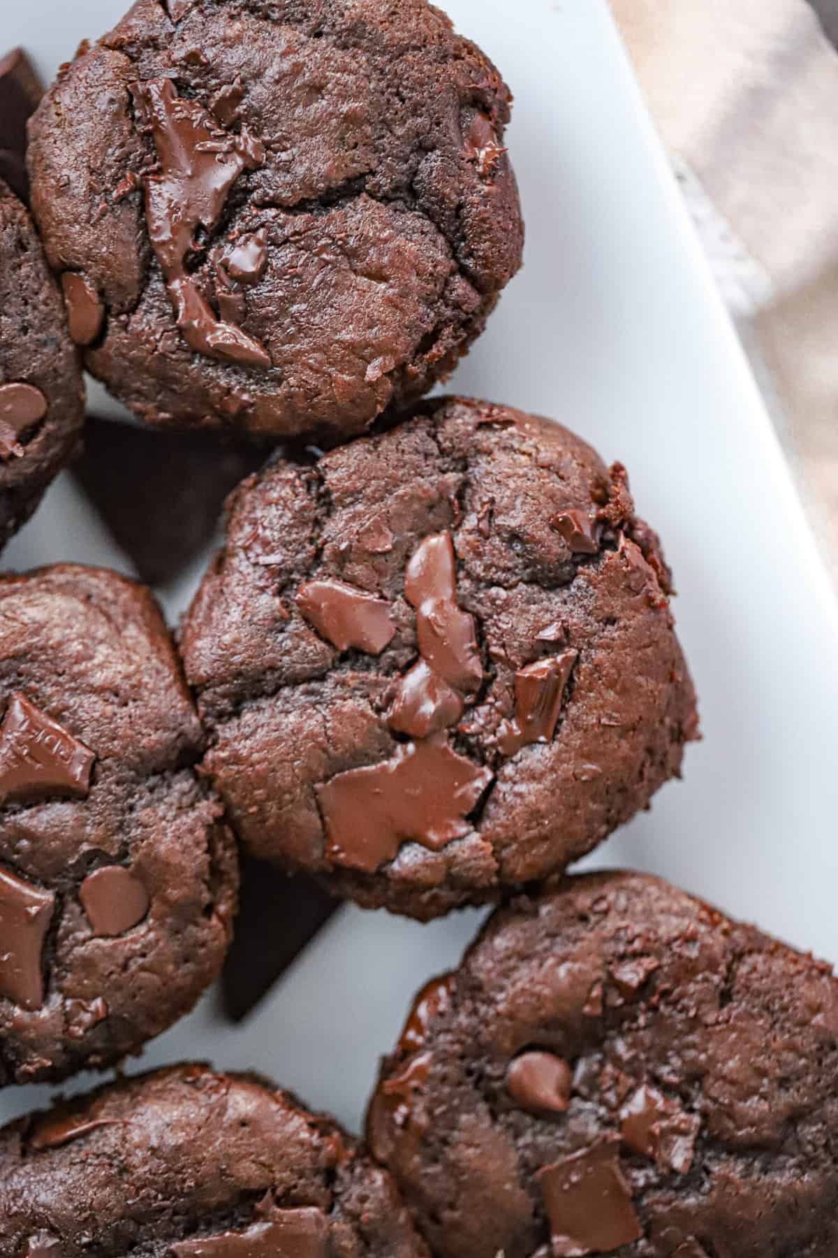 Stack of chocolate cottage cheese muffins with chocolate chunks with cottage cheese or Greek yogurt