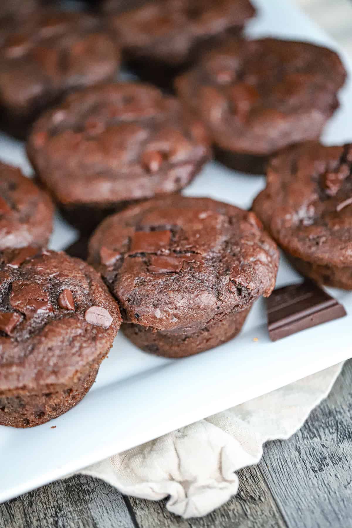 Freshly baked muffins with tall domed tops in pan with cottage cheese or Greek yogurt
