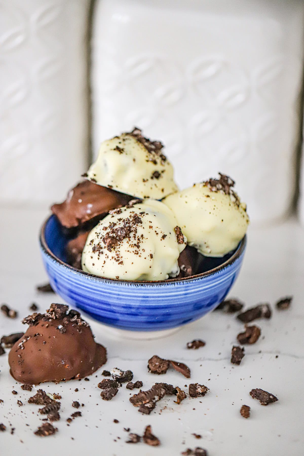 White chocolate coated dessert bites with crushed Oreo cookie crumbs frozen oreo clusters