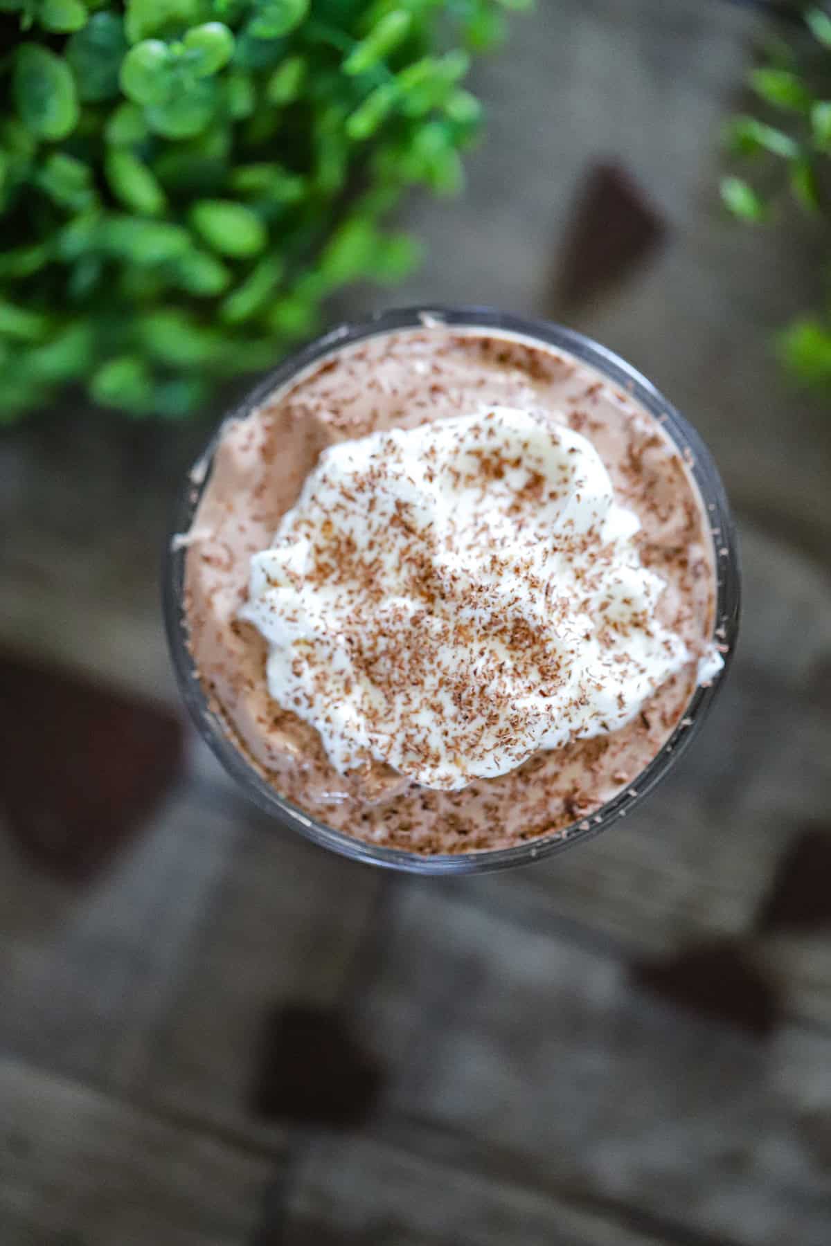Thick and creamy blended dessert served in a glass with a spoon