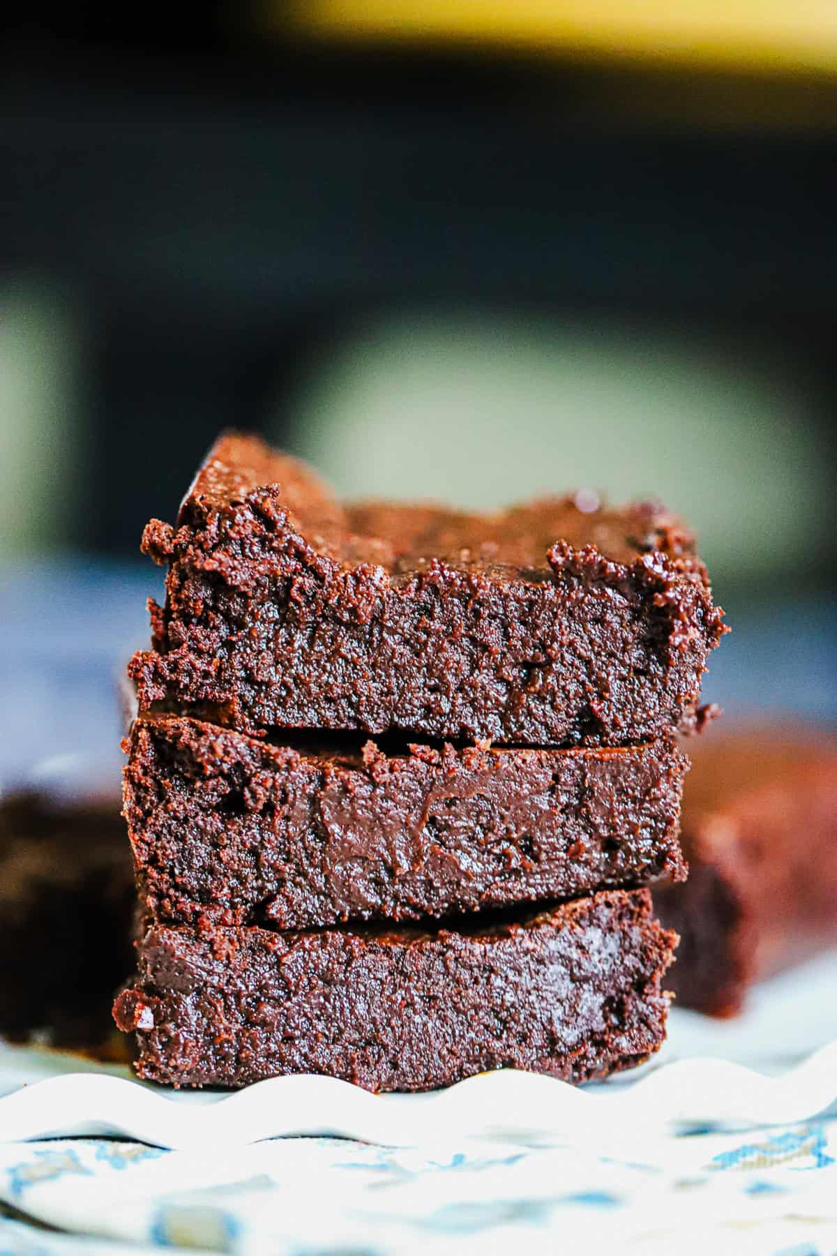 Thick chocolate brownie squares with shiny crackly top