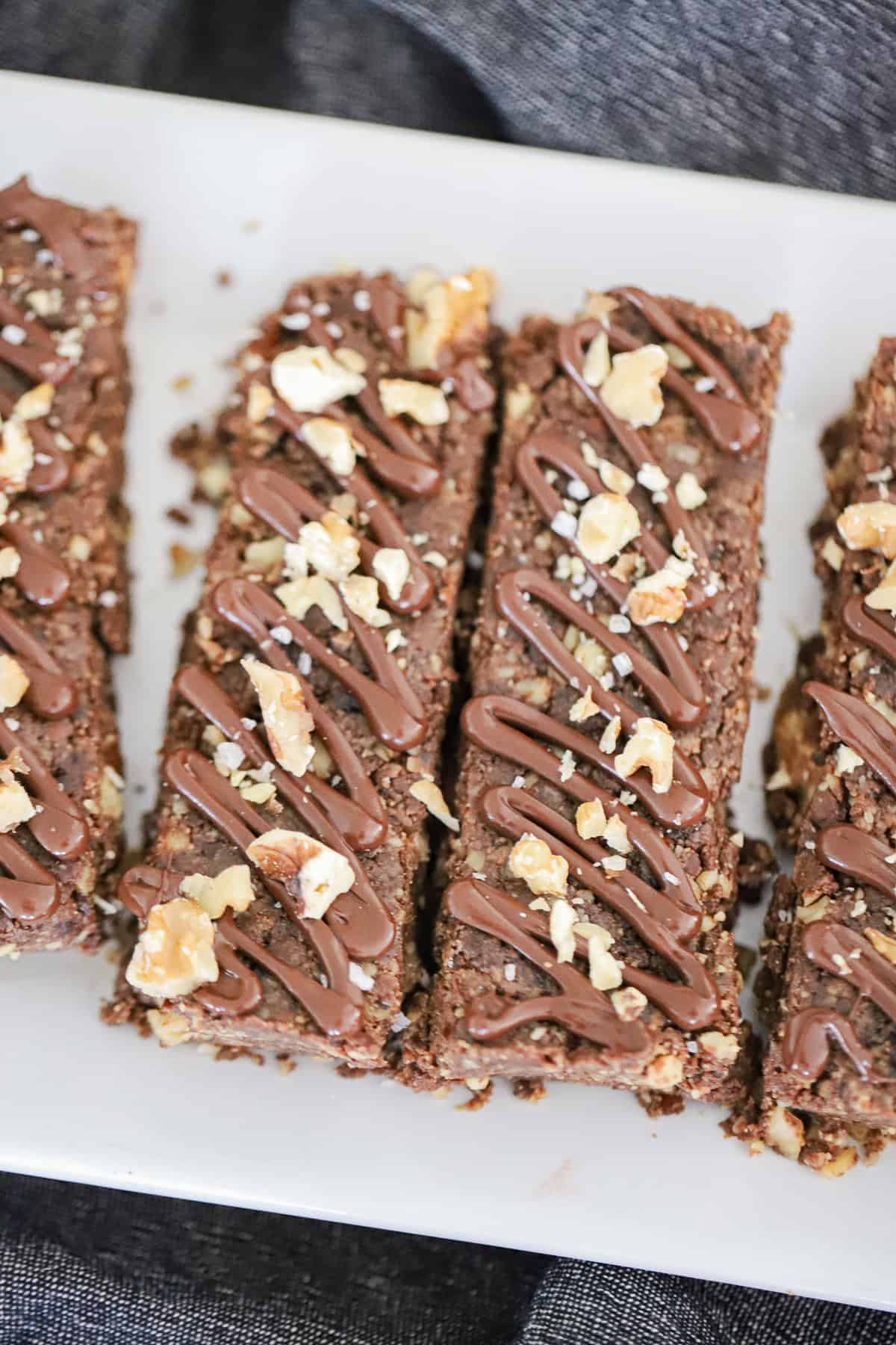 Ingredients for no bake brownie protein bars with dates and walnuts