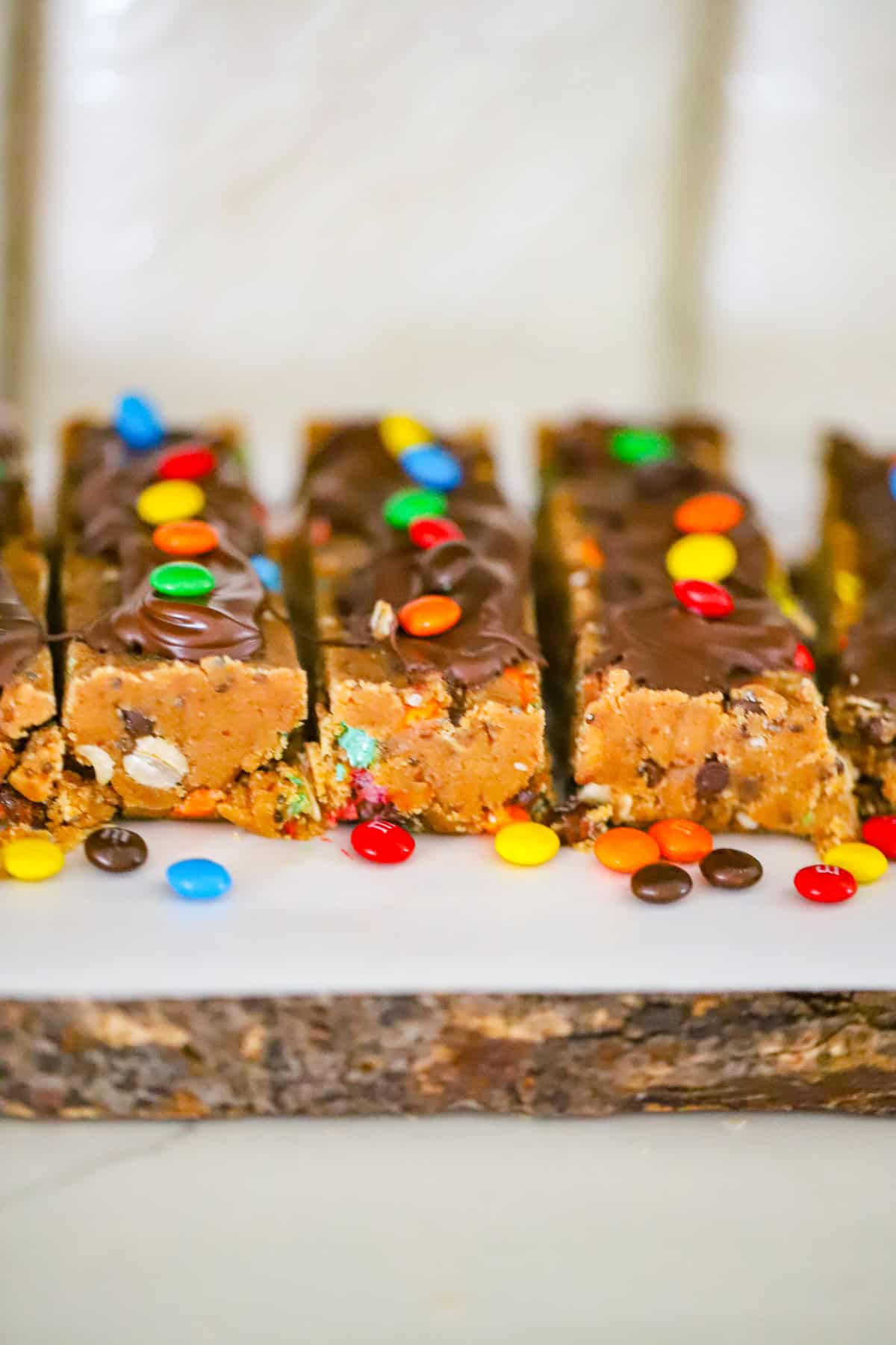 Monster cookie dough protein bar ingredients mixed in a bowl