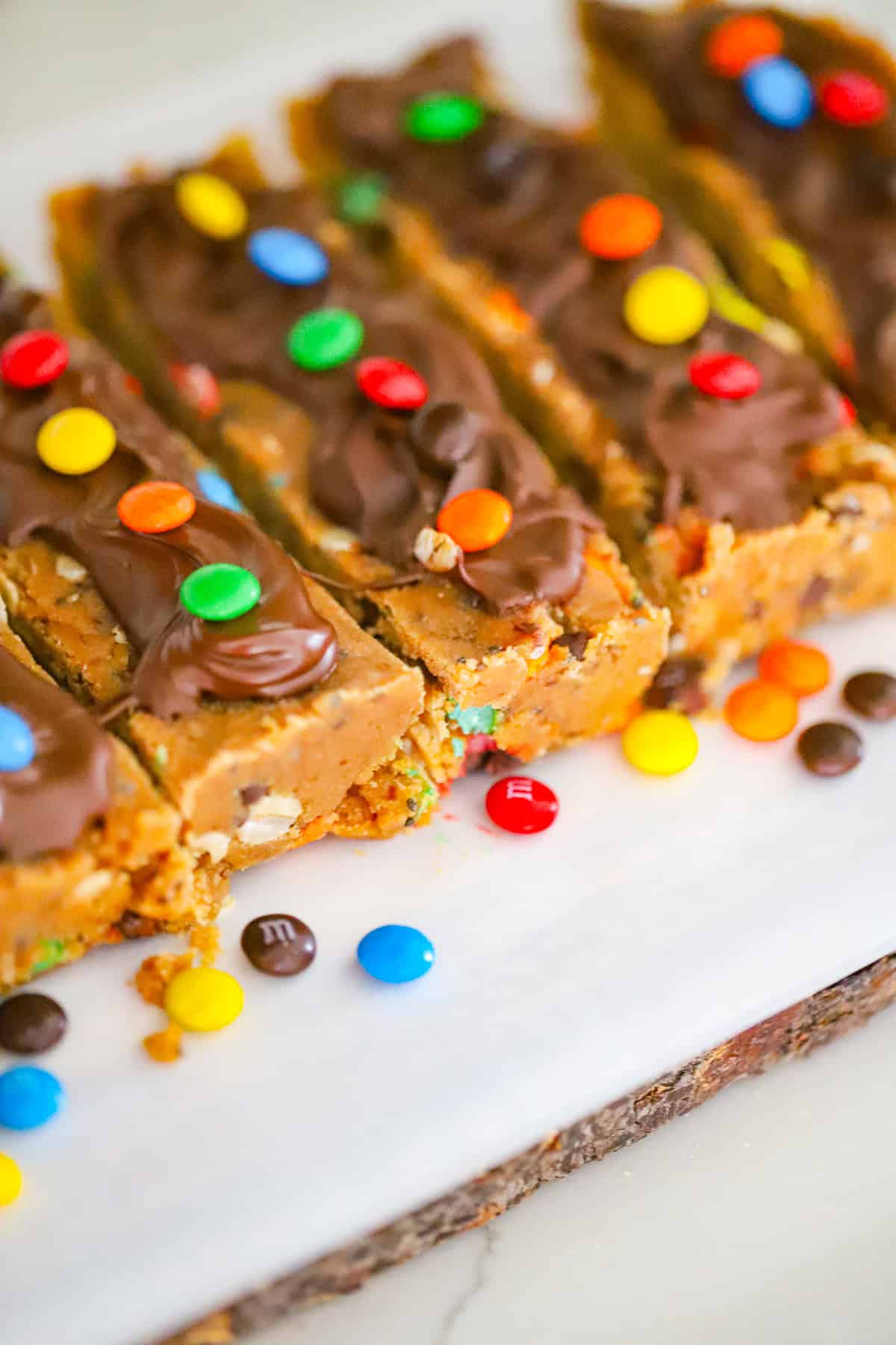 Thick sliced protein bars with chocolate chips and oats visible
