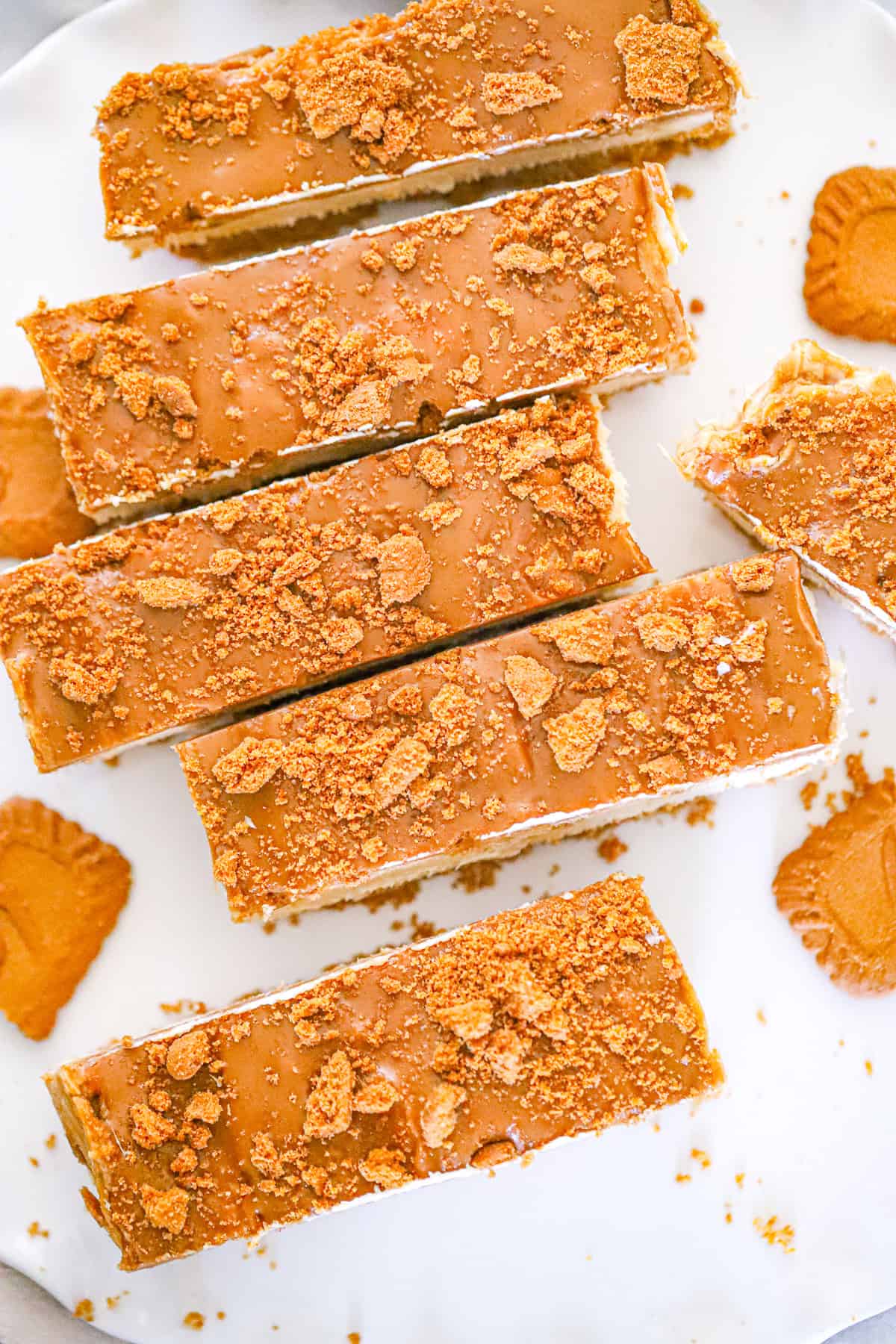 Creamy no-bake dessert bars topped with a glossy spiced spread