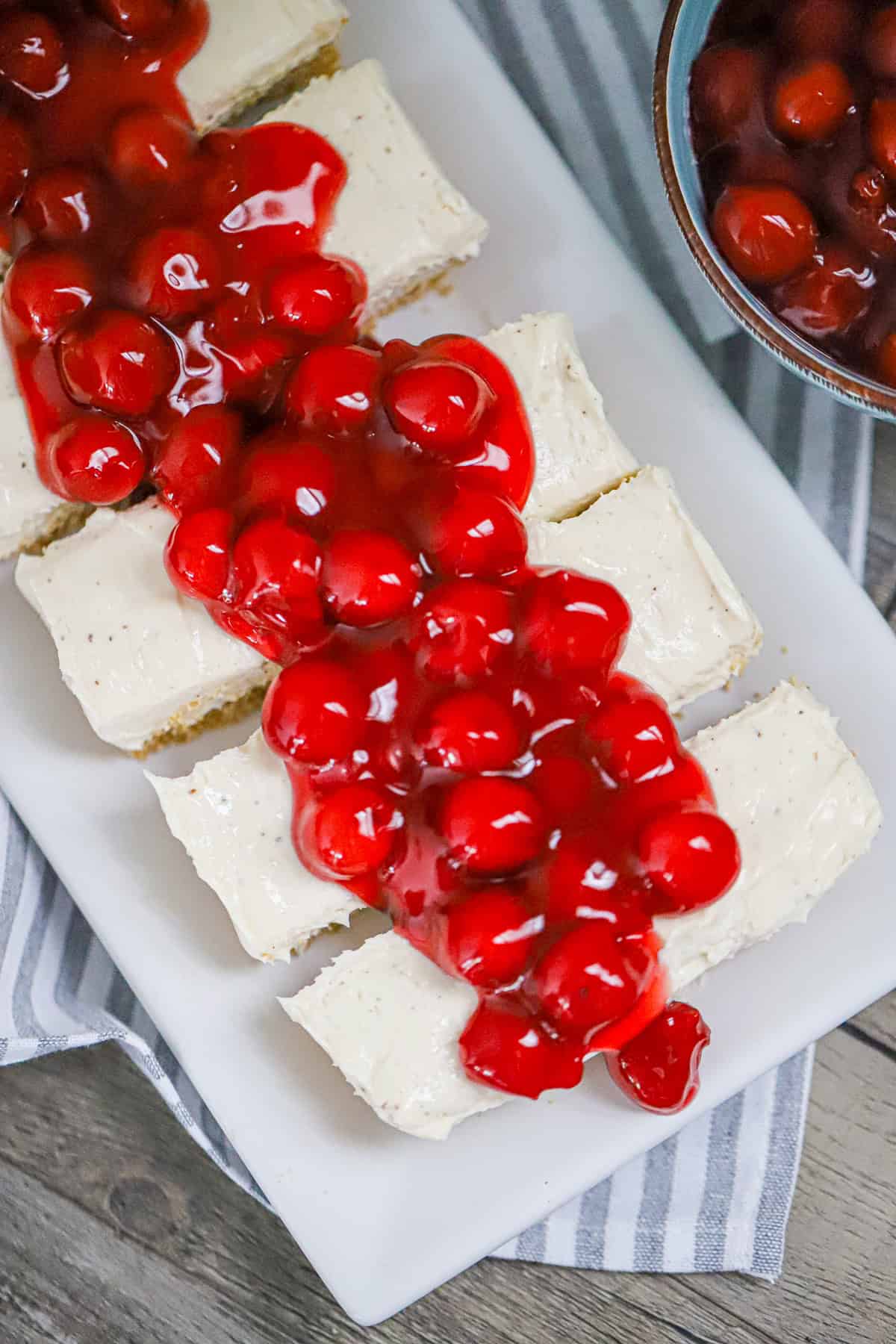 high protein vanilla bean cheesecake with cherries on top