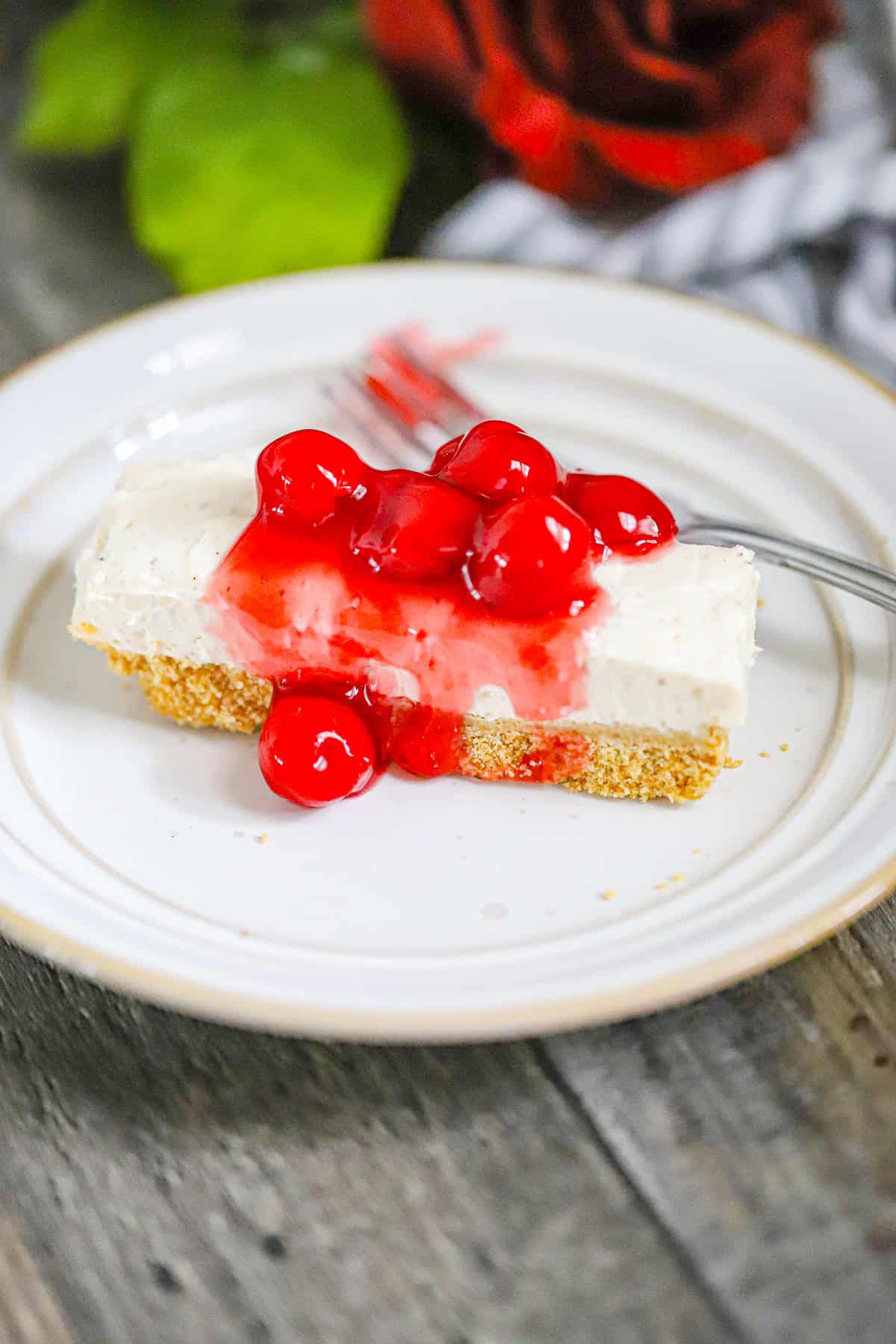 thick slices of cheesecake stacked on parchment paper