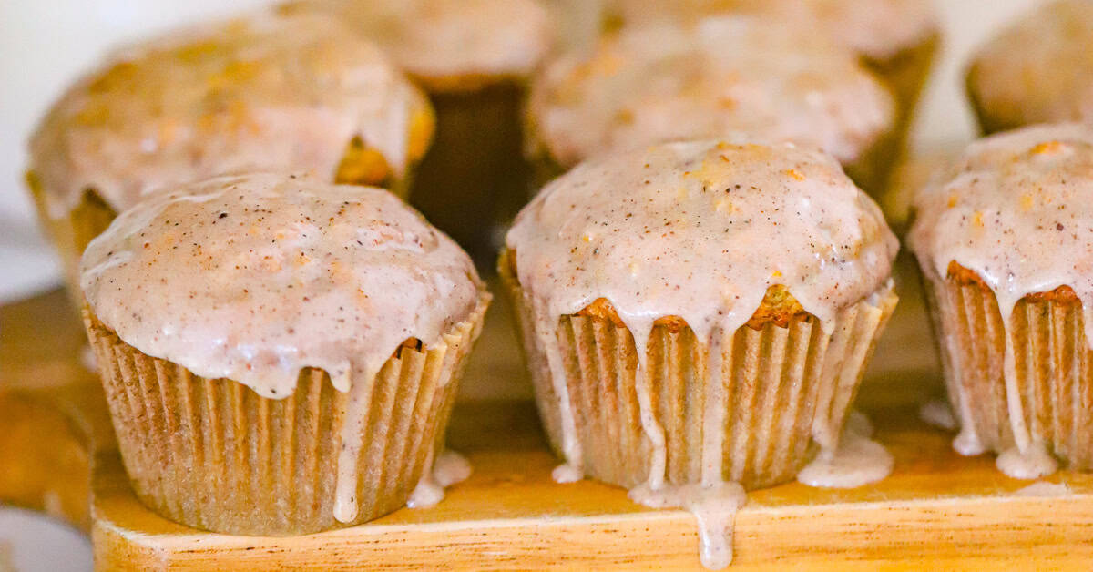 close up of vanilla bean glaze on a chai muffin