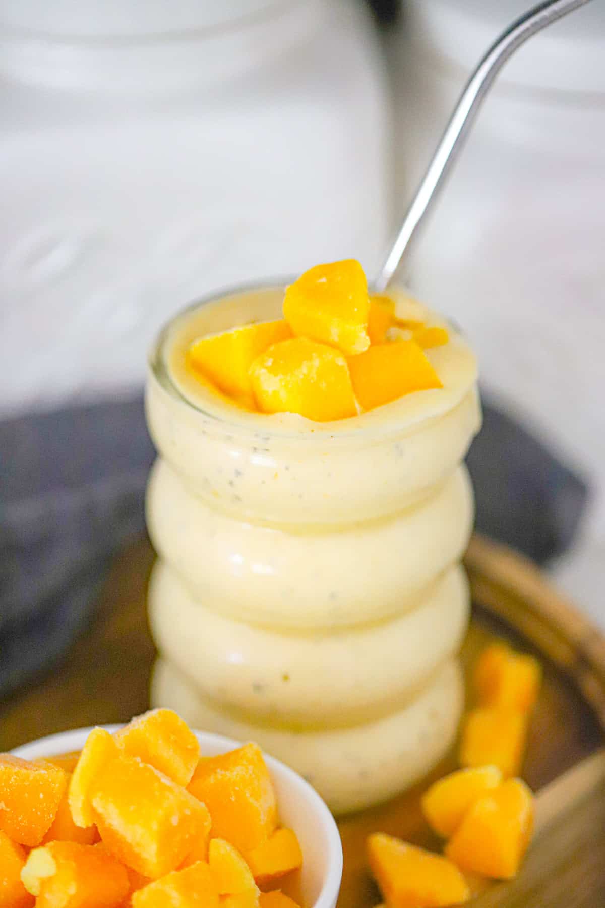thick tropical smoothie poured into a glass