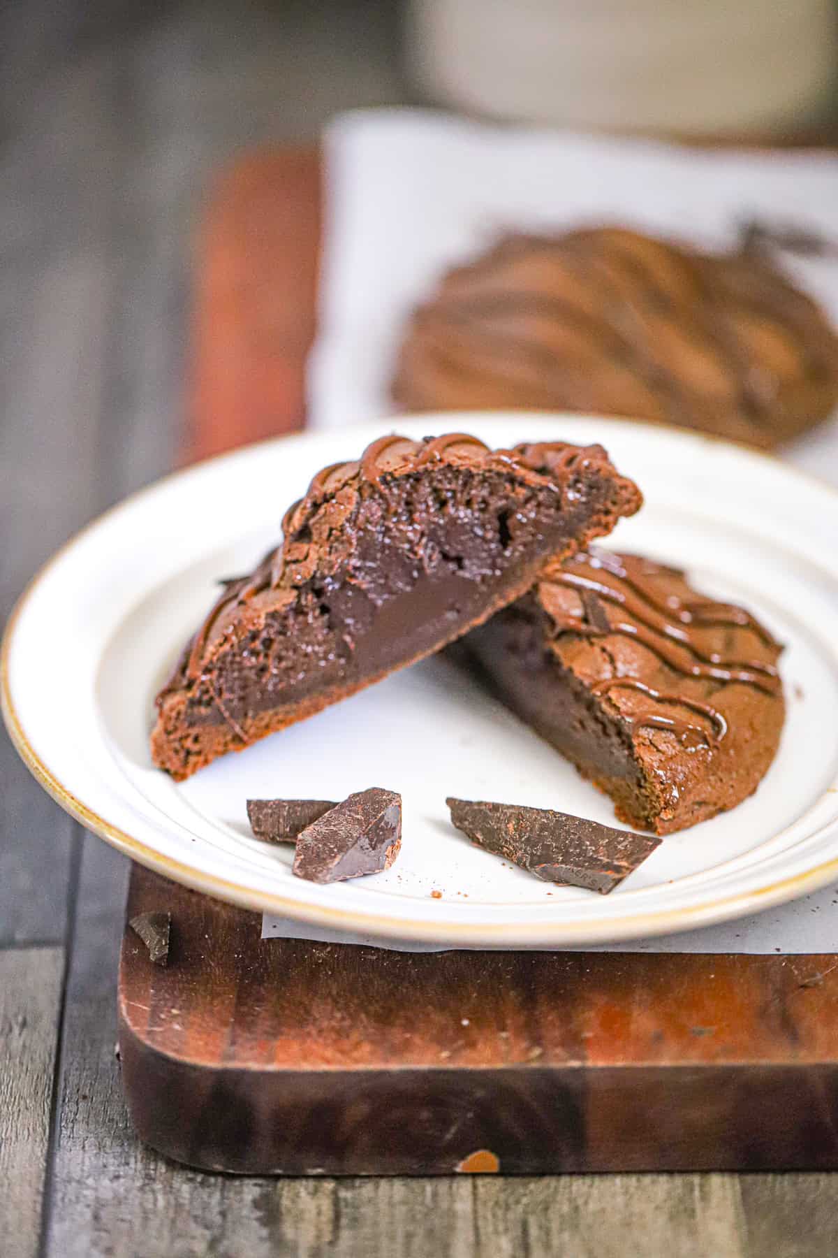 molten lava brownie cookie pulled apart to show the gooey core