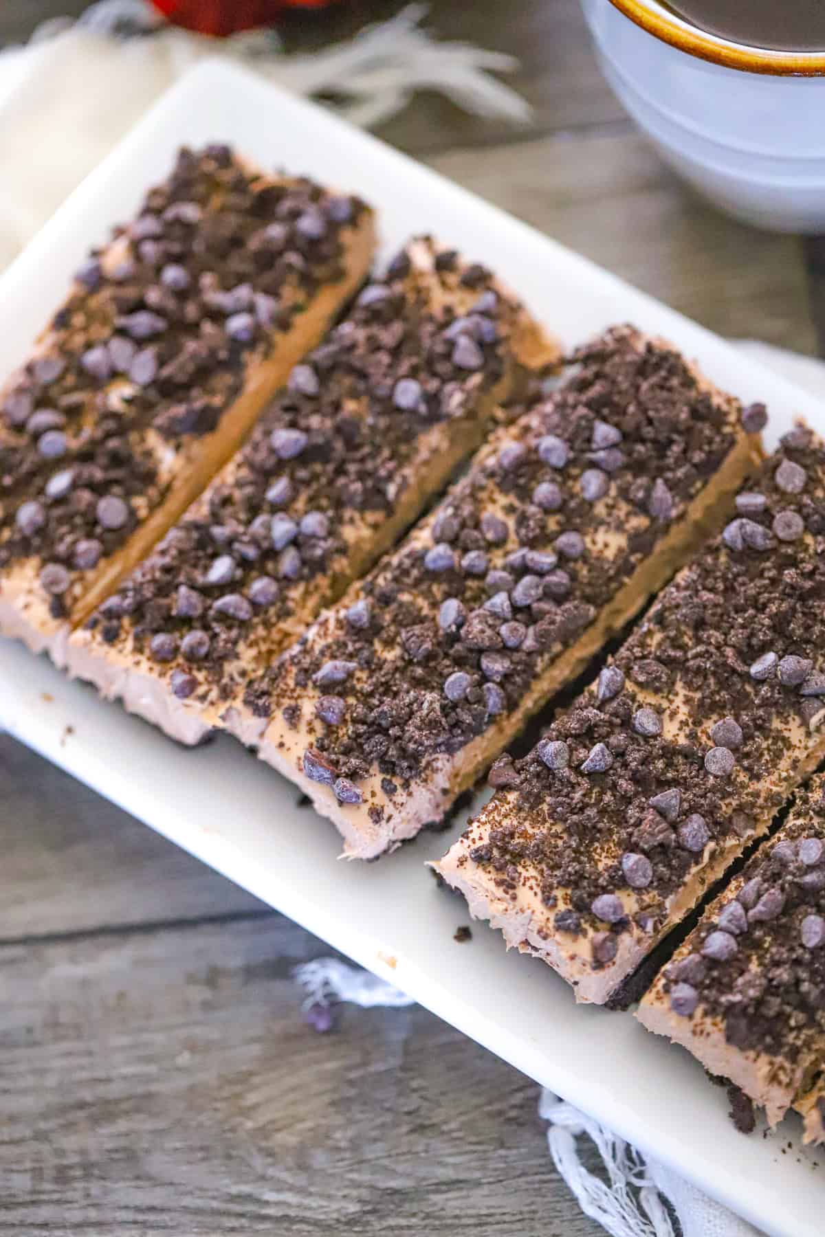 Mocha espresso protein cheesecake topped with mini chocolate chips and crushed Oreos dessert