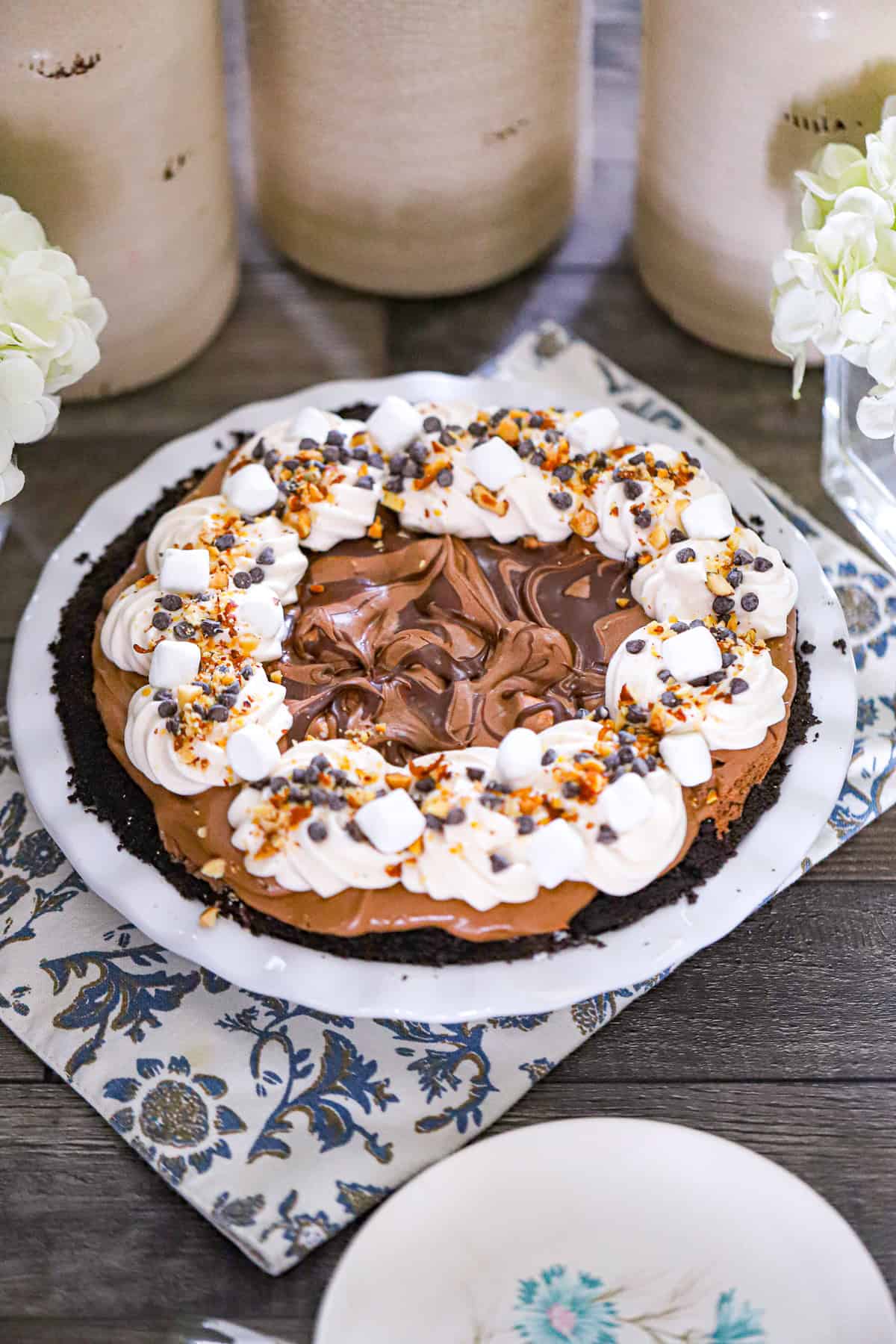 Loaded marshmallow chocolate chunk and almond topping piled high no bake rocky road pie hershey dessert