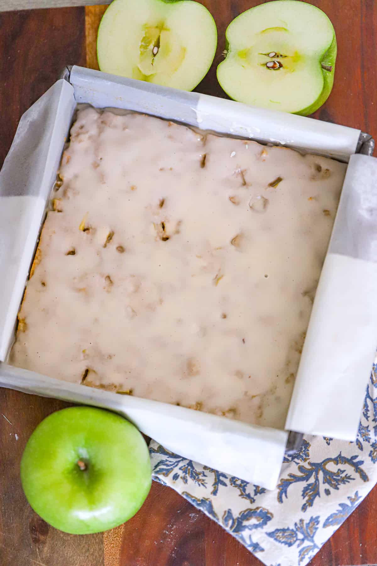 Chewy apple bars with a sweet vanilla glaze on top