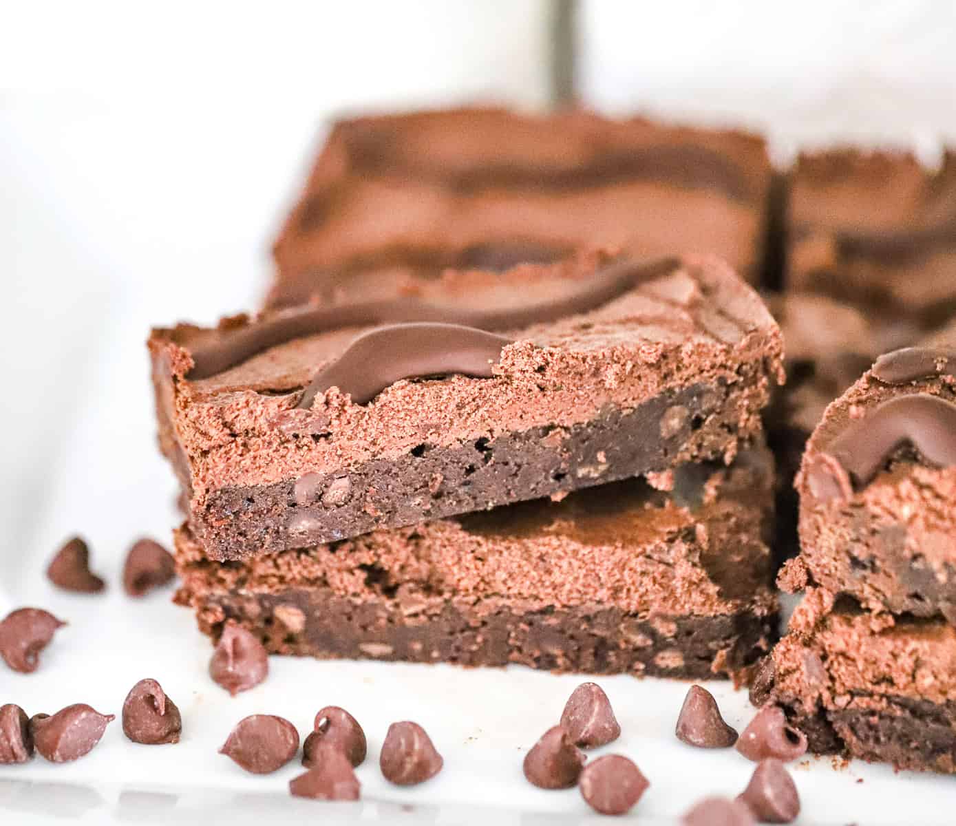 chocolate fudge round brownie bars cut into squares on parchment
