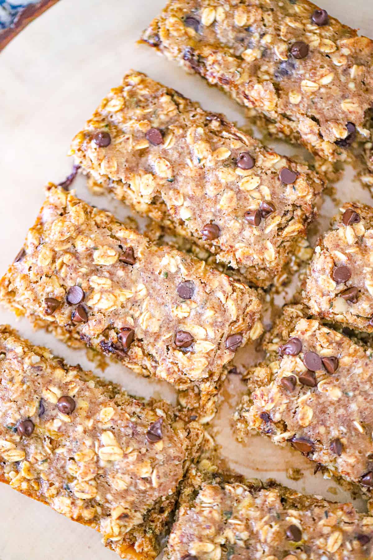 thick banana snack bars cut into squares on parchment paper