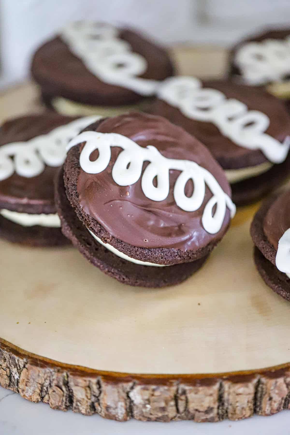 creamy marshmallow center beneath a glossy chocolate top and white icing swirl copycat Hostess desserts