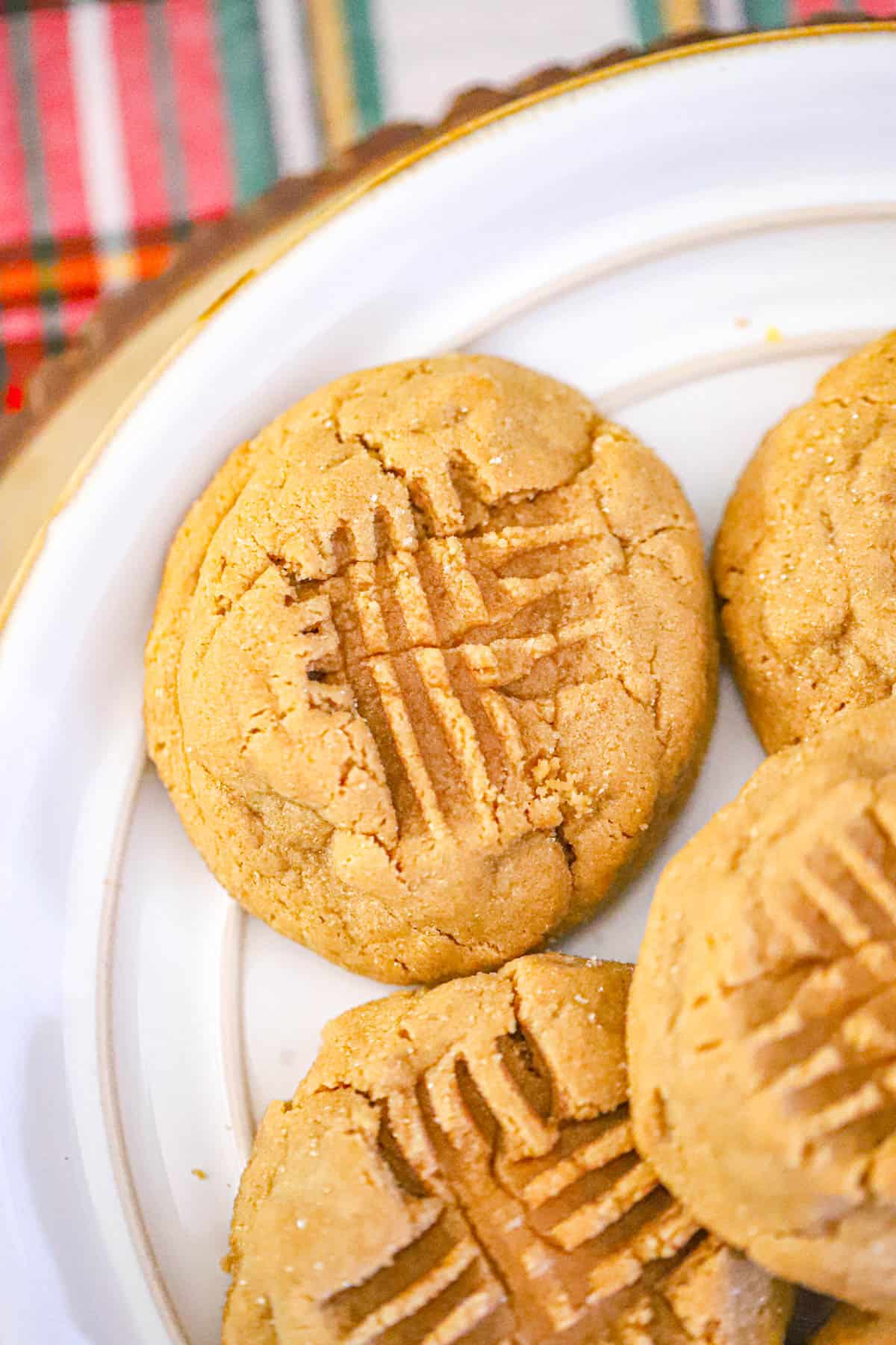 Jumbo maple peanut butter cookies with sparkling sugar and fork marks