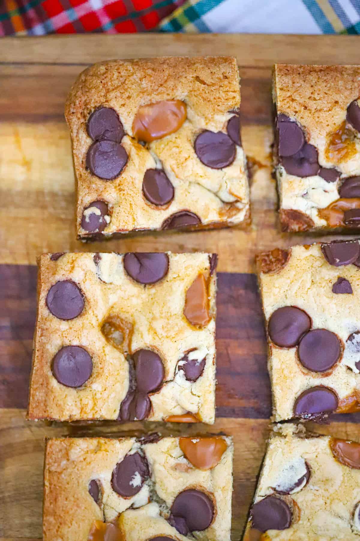 Gooey caramel cookie bars with melted chocolate chips and flaky salt