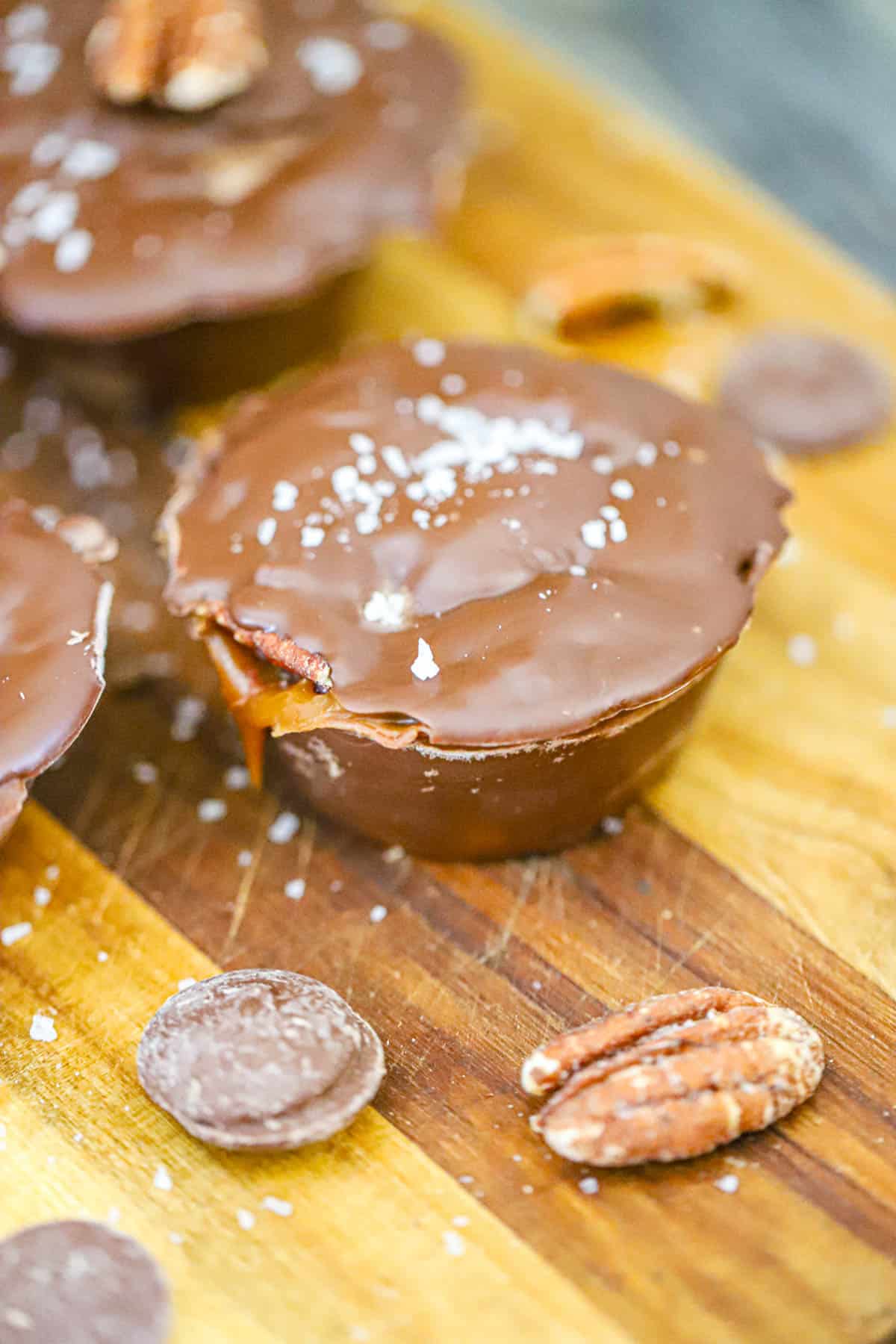 Small batch turtle Melted chocolate, brownie rounds, caramel, and toasted pecans ready for layering